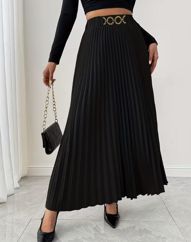 Black pleated midi skirt with a gold-toned ornate interlocking belt buckle in a high-waisted a-line design.