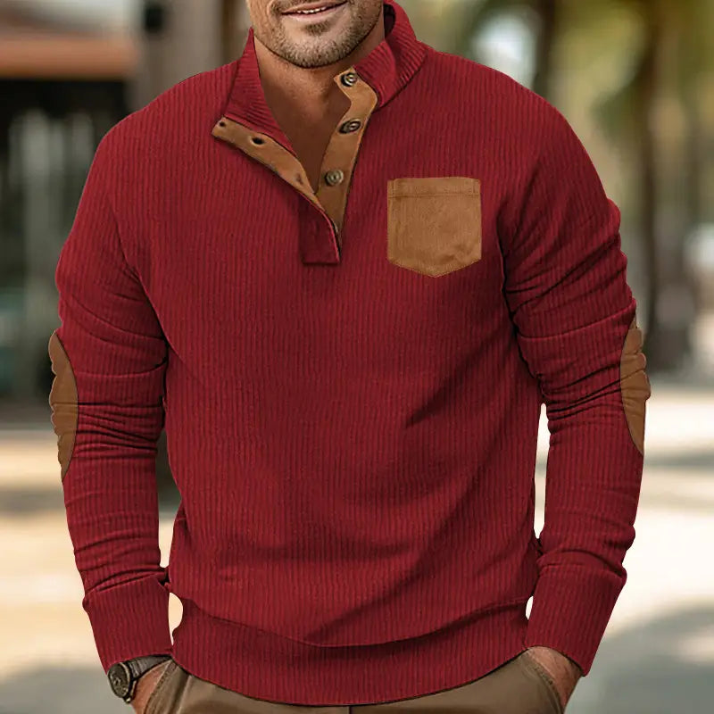 Slim fit corduroy patchwork pullover in red ribbed knit with tan leather accents on the collar, buttons, chest pocket, and elbow patches.