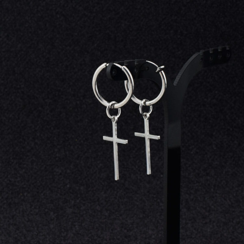 Minimalist stainless steel cross hoop earrings in silver with dangling cross charms displayed on the front side.