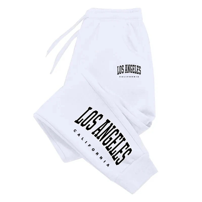 Pantalons de survêtement blancs avec lettrage noir « Los Angeles, Californie » sur la jambe et la ceinture, conçus pour un usage décontracté et sportif