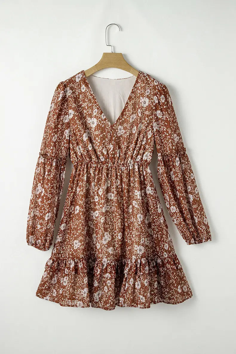 Bohemian rust floral tiered mini dress with long puff sleeves, v-neckline, and lightweight fabric.