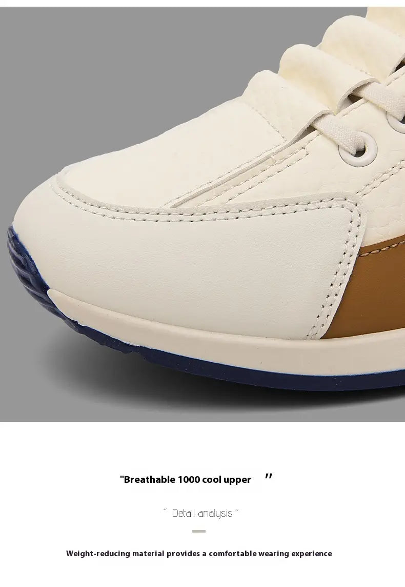 Men’s casual sports sneaker in white and tan with navy blue non-slip microfiber sole and breathable upper material.