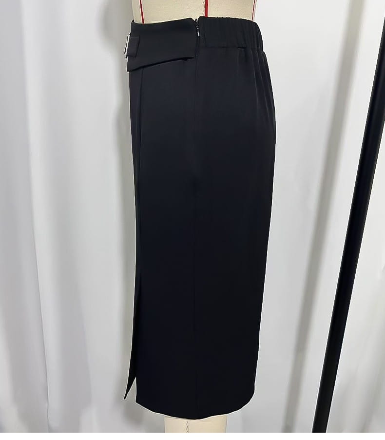 Black high waisted pencil skirt with silver buckle featuring a front zipper and side slit in a midi length.