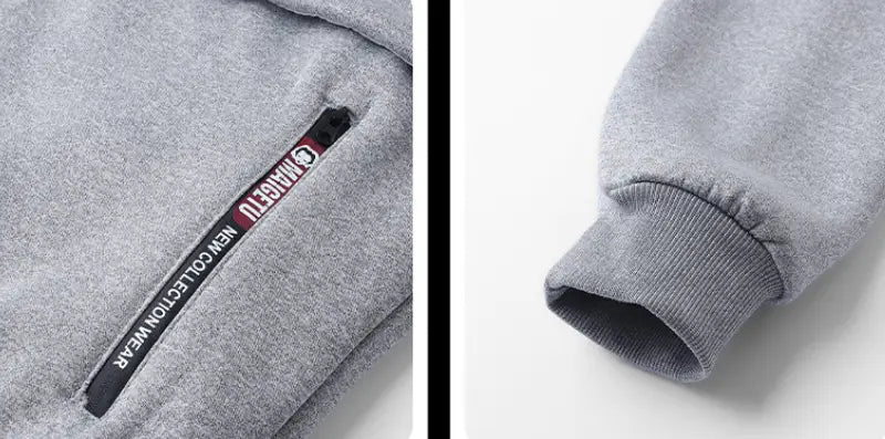 Herren-Schwergewicht-Sherpa-Fleecepullover mit Reißverschluss, innen mit Sherpa gefüttert, aus grauem meliertem Material, mit gerippten Bündchen und schwarzem Reißverschluss-Schieber mit magefu-Branding.