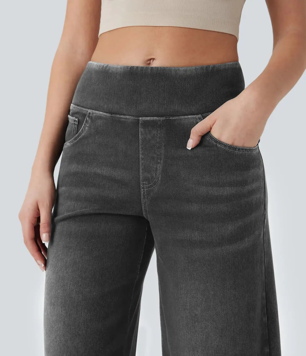 Wide leg stretchy high waisted jeans in dark gray denim with a high waistband and front pockets.