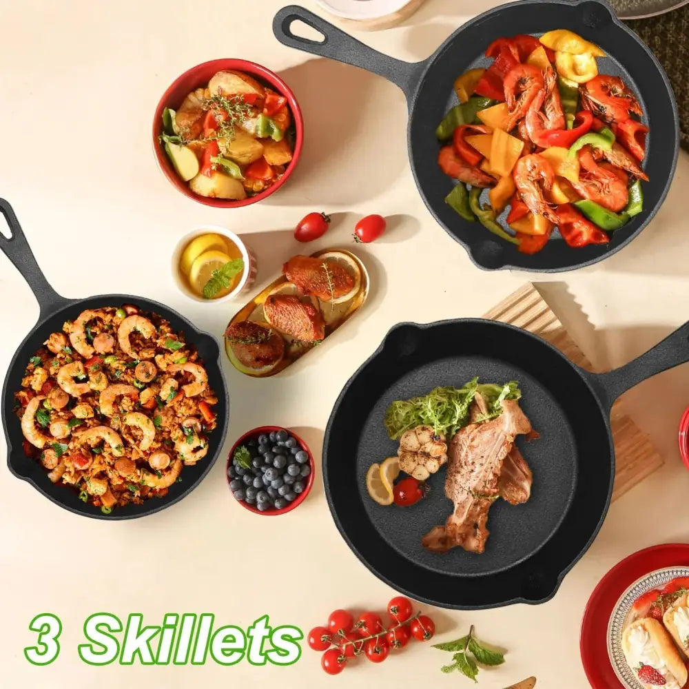 Three black pre-seasoned cast iron skillets filled with colorful cooked meals in a 3-piece skillet set