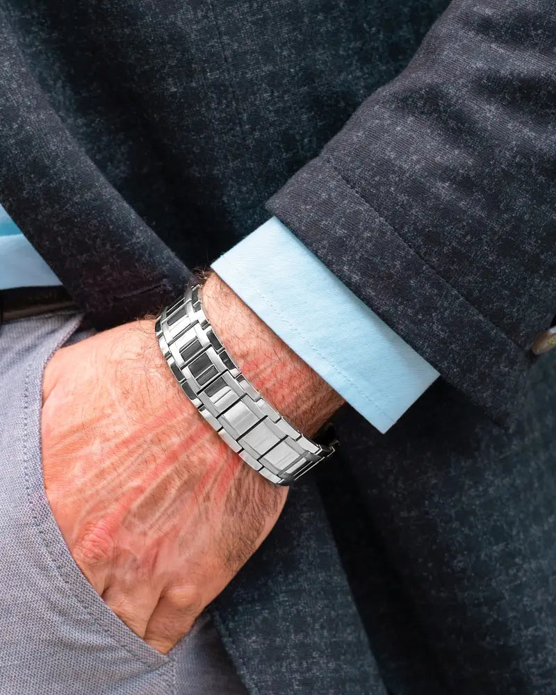 Men’s high strength silver titanium magnetic therapy bracelet with a sleek silver-toned polished stainless steel band