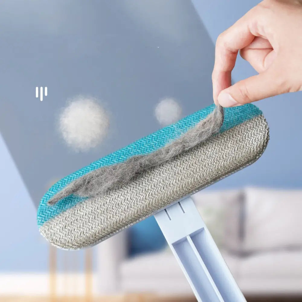 Teal and gray dual-sided 4-in-1 multi-surface pet hair and screen cleaning brush with textured fabric surface for efficient hair removal