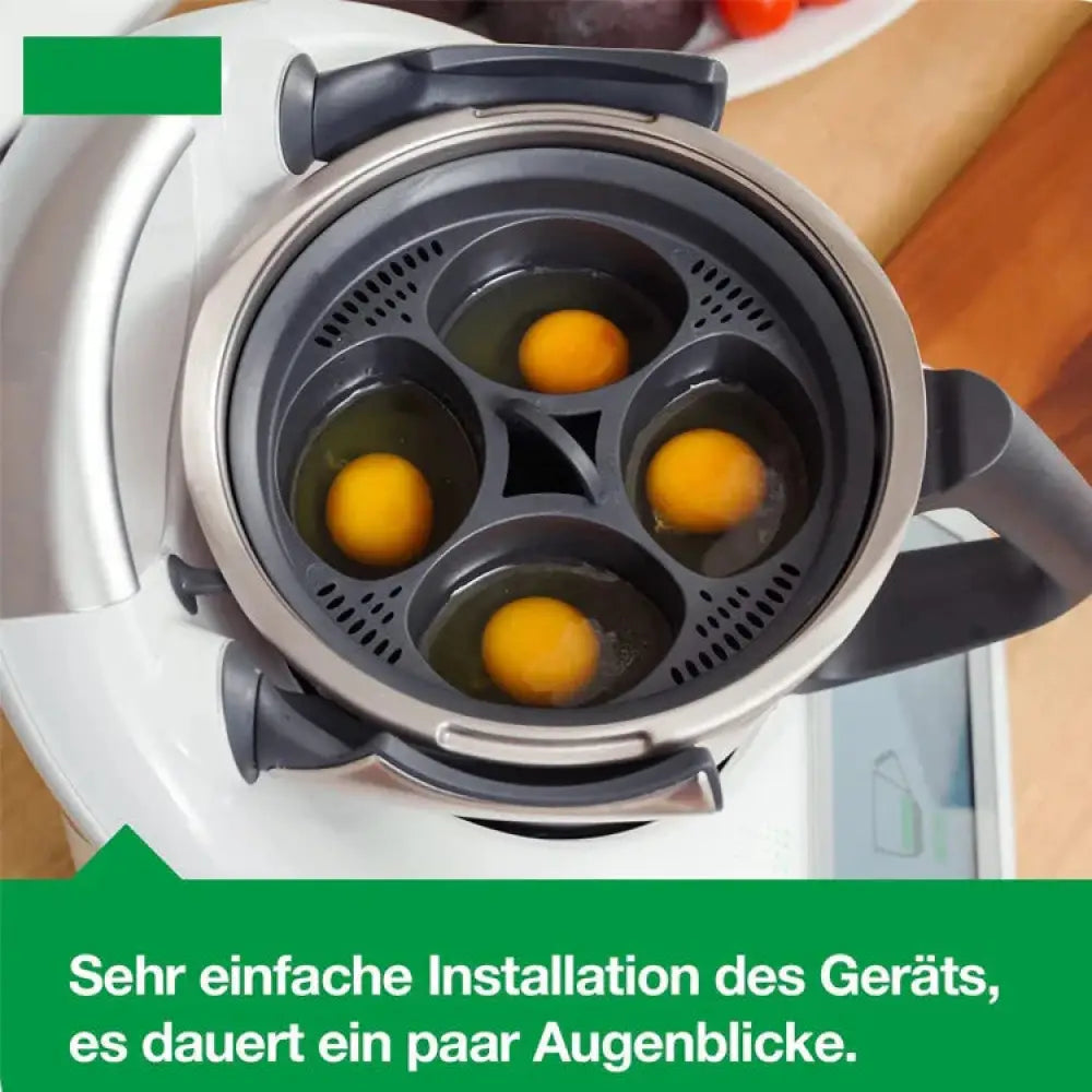 Silver and black steam cooker with four silicone egg holders designed for easy installation in 4-in-1 poacher set