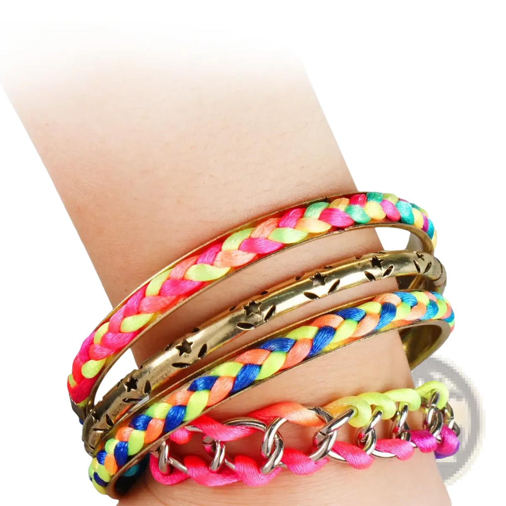 A stack of four neon pink and yellow braided bangles with gold star accents and metallic details