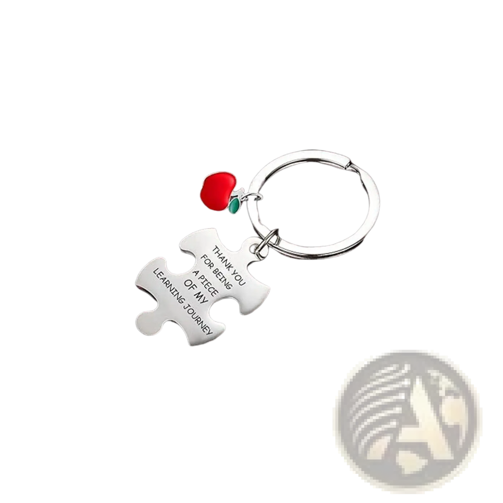 Silver stainless steel puzzle-piece teacher appreciation keychain with engraved message and red apple charm