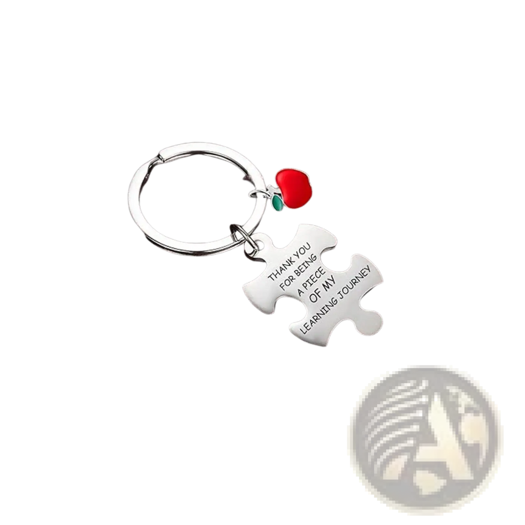 Silver stainless steel puzzle piece keychain with engraved message and small red apple charm for teacher appreciation