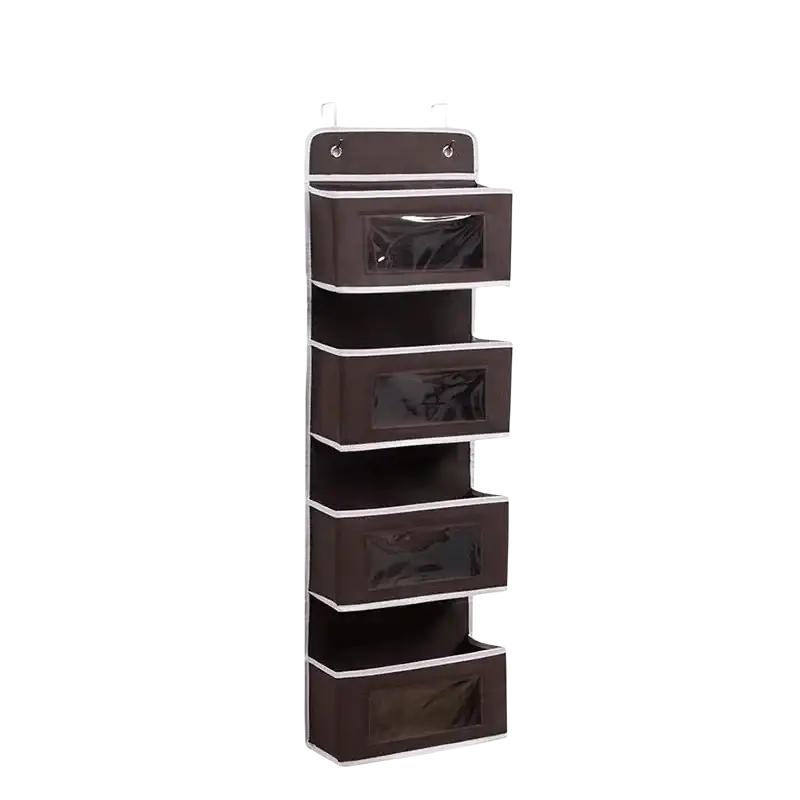 Brown fabric over door organizer with four clear compartments and white trim for hanging storage use