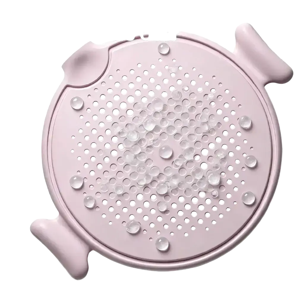 Pink silicone drain cover with circular perforations and handles designed for use with a 4-wheel ab roller board and knee pad