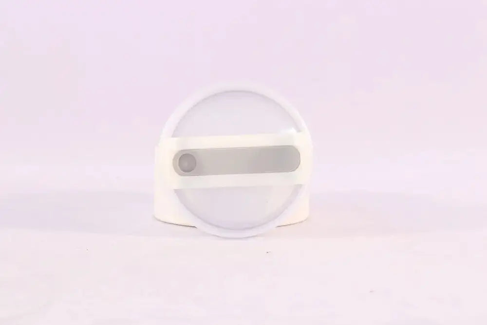 White circular phone ring with gray horizontal bar and button detail on arbaglobal 40 oz insulated tumbler handle