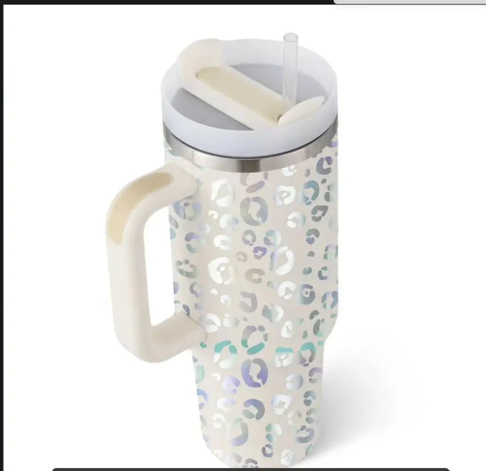 A white Arbaglobal 40 oz insulated tumbler with shimmering leopard print, stainless steel rim, handle, and straw