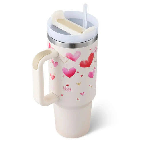 Cream-colored insulated tumbler with handle and straw featuring pink and red watercolor hearts by Arbaglobal