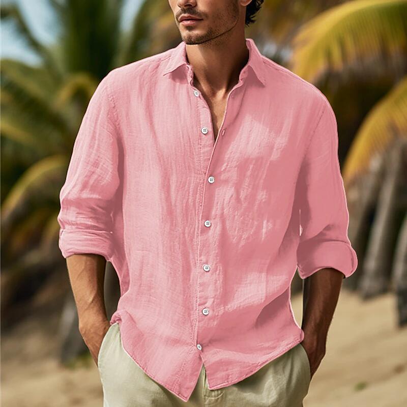 A light pink men’s relaxed fit cotton linen long sleeve shirt with a button-down front and rolled-up cuffs.