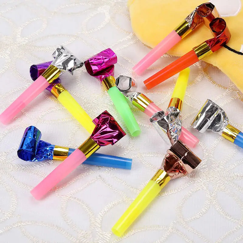 A collection of colorful party blower noisemakers for kids birthdays featuring shiny metallic tops and vibrant plastic bodies in pink, yellow, blue, green, orange, purple, silver, and rose gold in a 10 pack.