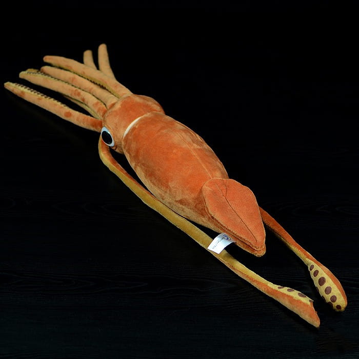 Orange plush squid toy with textured fabric and embroidered eyes measuring 32cm designed as a cuttlefish plush stuffed animal.