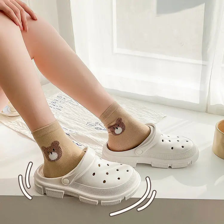 pink rubber unisex lightweight eva garden clogs and beach slippers with thick textured sole and circular perforations