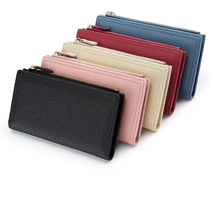A collection of cowhide leather anti theft RFID long zip wallets in black pink beige red and blue featuring textured finishes.