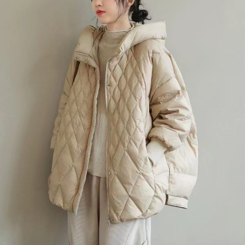 Beige quilted white duck down puffer jacket with a hood and button closures designed as a loose hooded winter coat.