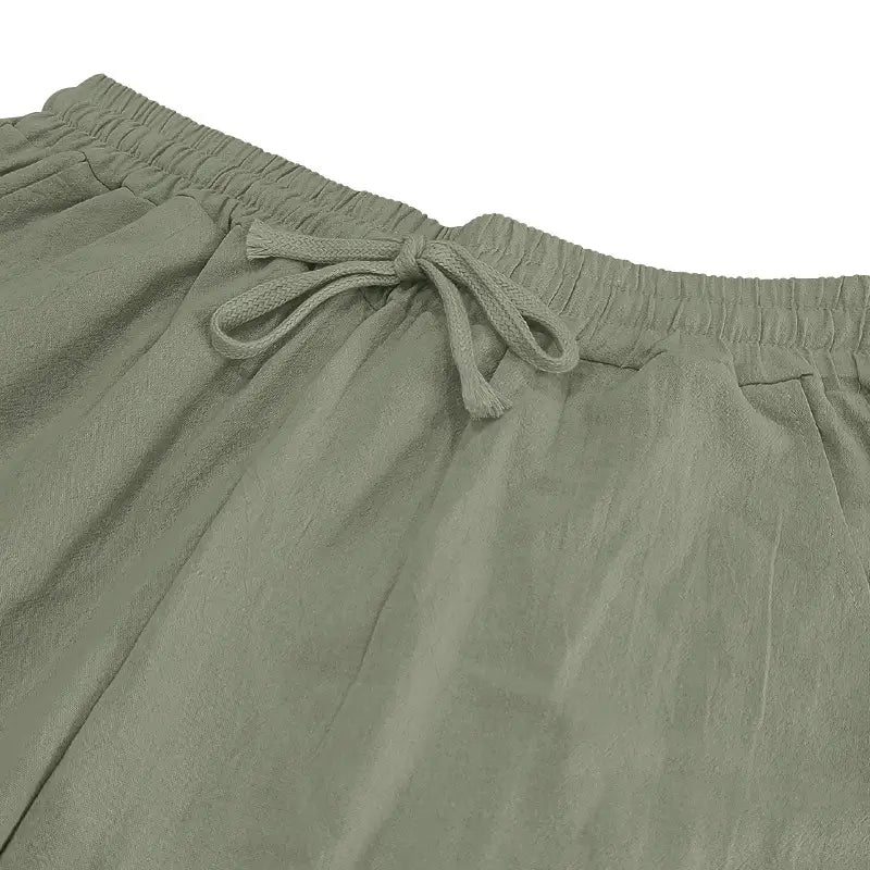 olive green linen men’s joggers with an elastic waistband and matching drawstring designed for casual wear