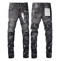 men’s distressed slim fit black denim jeans featuring a paint splatter design and ripped knees
