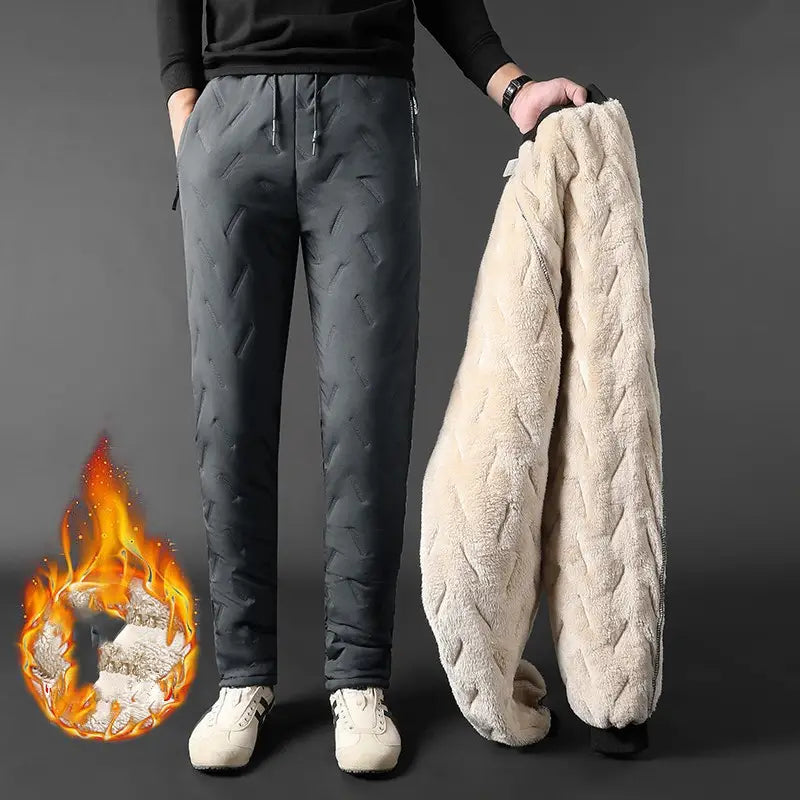 Thermal fleece lined winter joggers in dark gray quilted fabric with a plush cream-colored fleece lining featuring a braided texture.