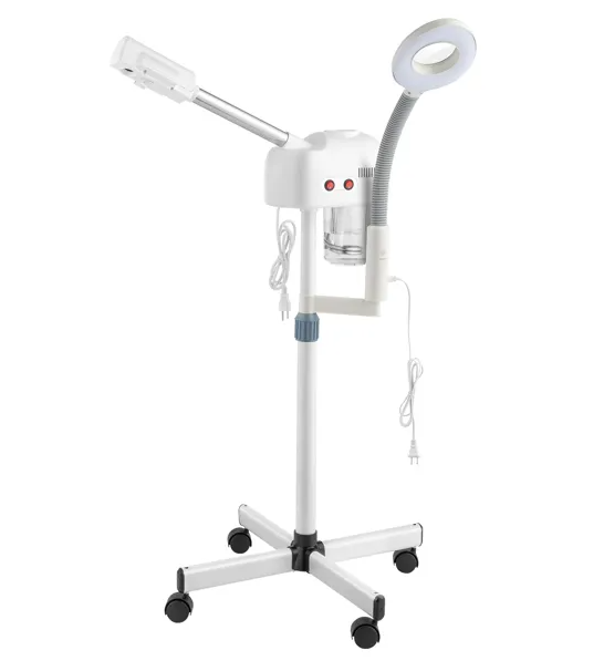 Le vaporisateur facial professionnel est blanc, monté sur support avec des bras réglables, une lampe de grossissement circulaire 3×, et un réservoir d’eau en verre.