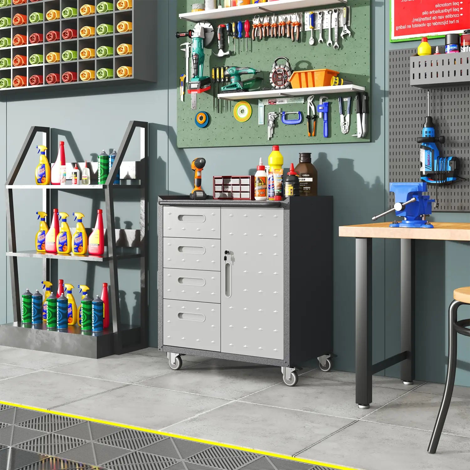 Gray metal tool storage cabinet with wheels featuring three drawers and a door with a dotted texture on the front panels