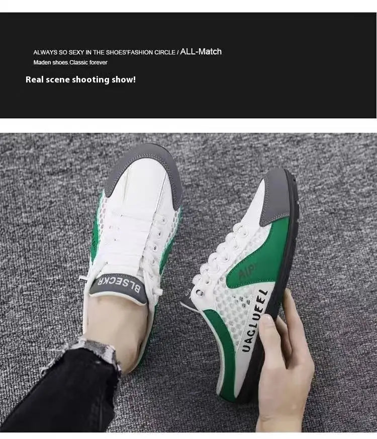 Des baskets décontractées respirantes à enfiler en maille pour hommes, en maille blanche et verte, avec des accents gris, présentant un design épuré et une inscription audacieuse sur le côté.