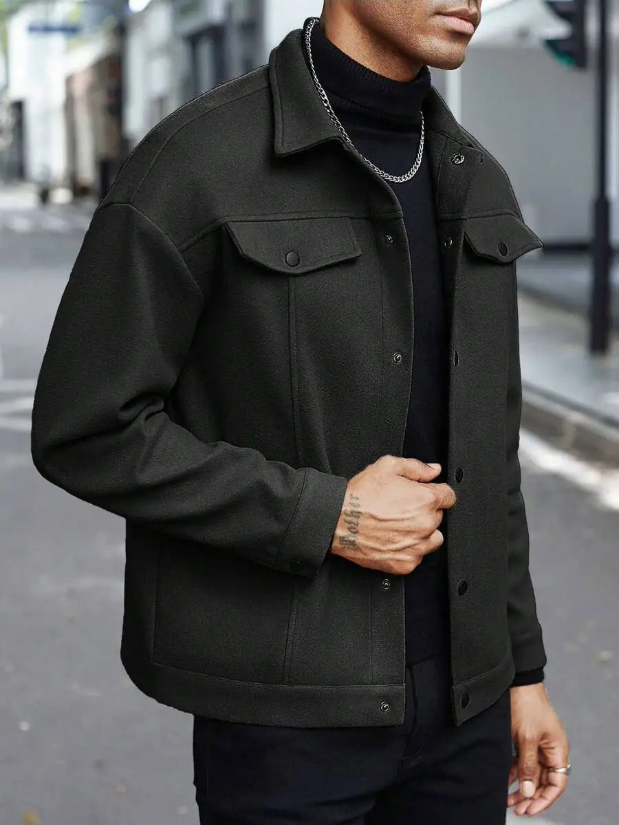 Black denim jacket with buttoned front chest pockets and collar displayed as men’s classic slim fit wool blend lapel jacket.