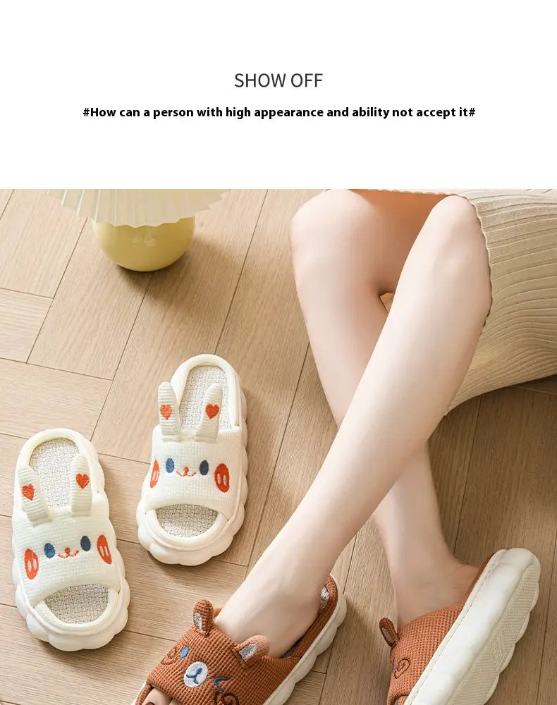Cream-colored cartoon animal embroidered open toe linen slippers featuring bunny-themed facial embroidery and heart details.