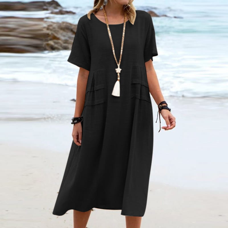 black loose-fitting tiered linen midi dress with short sleeves and a relaxed silhouette ideal for beachwear