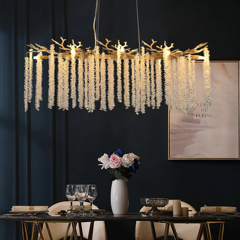 39 inch golden crystal waterfall pendant light featuring a gold-toned antler-shaped chandelier adorned with cascading strands of clear crystal beads.