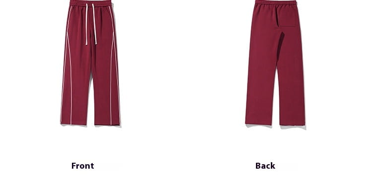 Maroon wide leg striped track pants with white side stripes and a drawstring waistband designed for athletic wear.