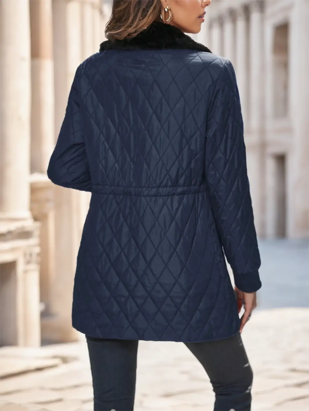 Navy blue quilted padded winter coat with black faux fur collar designed for cold weather.