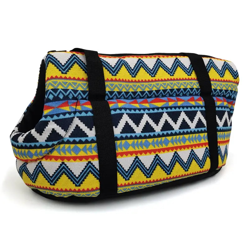 Warm pet carrier canvas fleece travel bag featuring vibrant geometric patterns with bold yellow navy blue and white stripes accented by red and light blue details.
