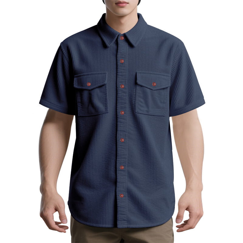 Navy blue loose corduroy short sleeve workwear shirt with vertical ribbed texture and red buttons.