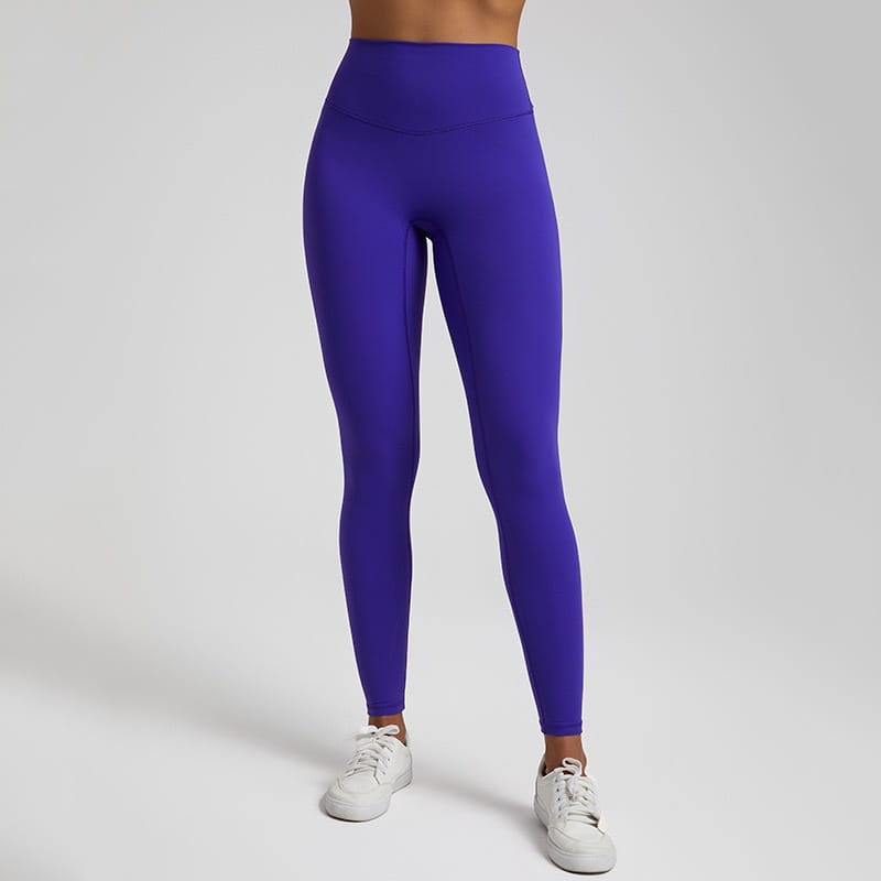 Vibrant purple high waisted stretch fitted leggings made of stretchy form fitting fabric.