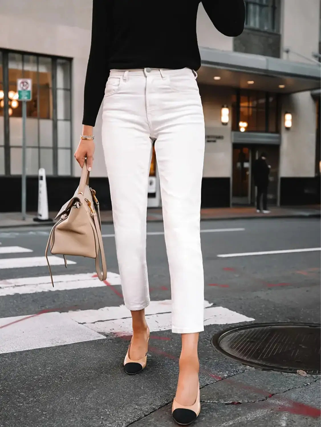 Slim fit straight trousers in white high-waisted straight-leg jeans with a clean modern cut.