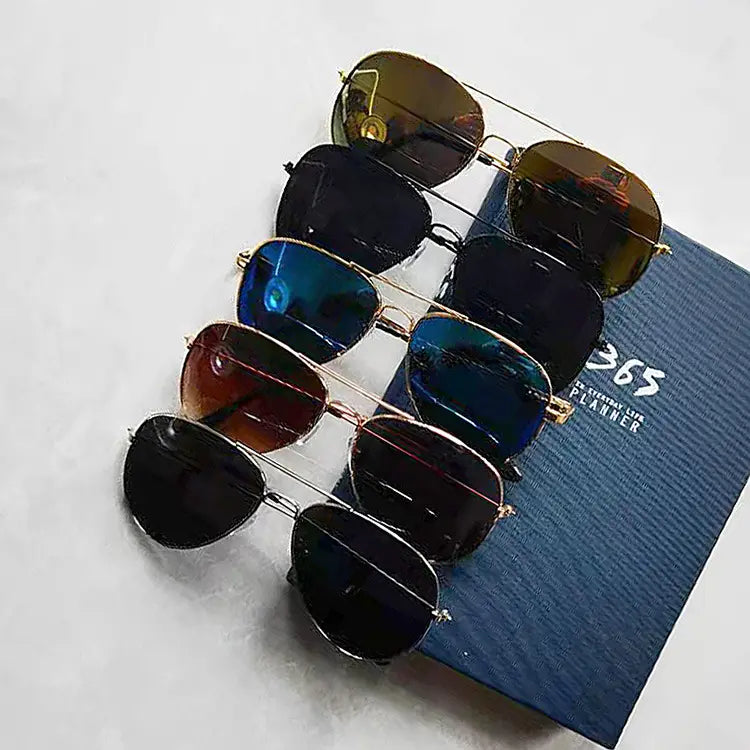 A set of six classic gold rimmed aviator sunglasses with UV protection featuring reflective lenses in shades of brown blue and black with gold-toned metal frames.