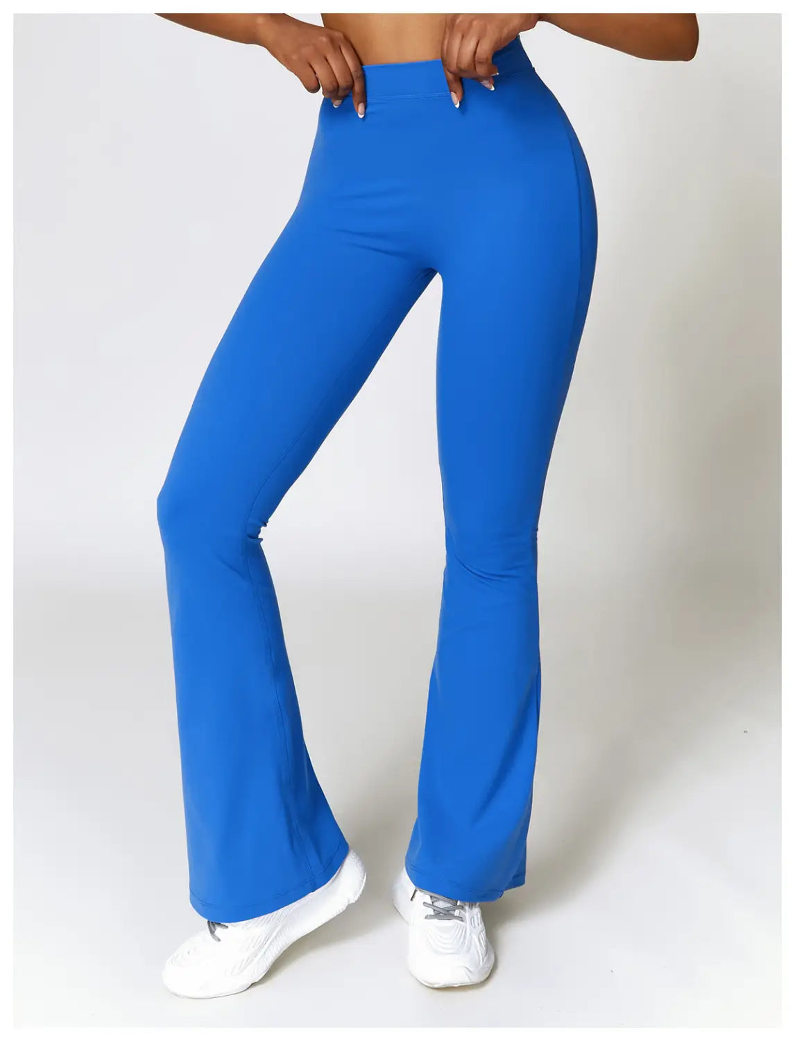 Bright blue high-waist flared yoga pants made from stretch fabric for activewear use.
