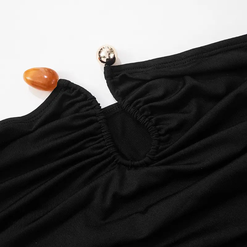 Black stretchy strapless keyhole crop top with gathered neckline and silver toned button detail.