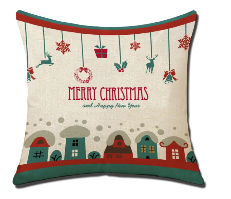 Beige christmas linen pillowcase featuring festive red and green holiday decorations of reindeer snowflakes a wreath and houses.