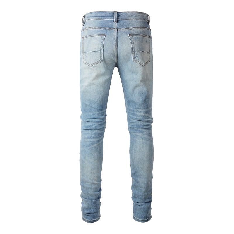 Men’s slim fit bandana patch light wash distressed jeans made of denim with a slim-fit cut and subtle fading for a casual modern look.