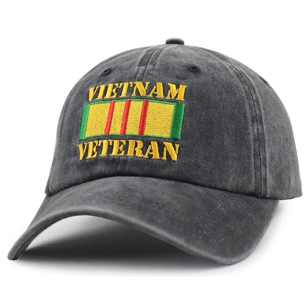 Dark gray denim baseball cap featuring embroidered vietnam veteran text and a colorful yellow, red, and green ribbon patch.