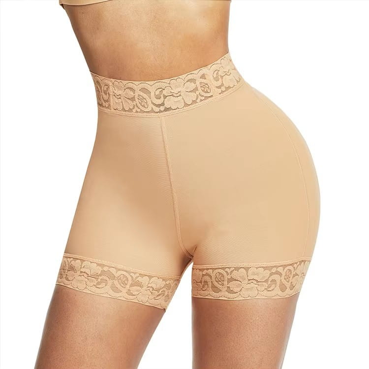 Beige high waist shapewear shorts with floral lace trim at the waistband and leg openings designed as a lace butt enhancer.
